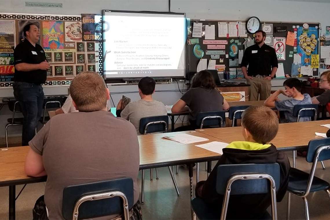 Two Pickering employees presenting at Marietta Middle School Career Day