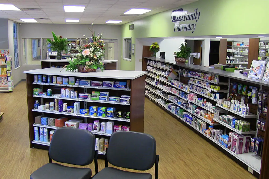 Pharmacy shelves and prescription counter