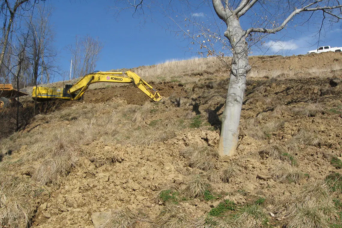 Material being removed to repair the slip area.