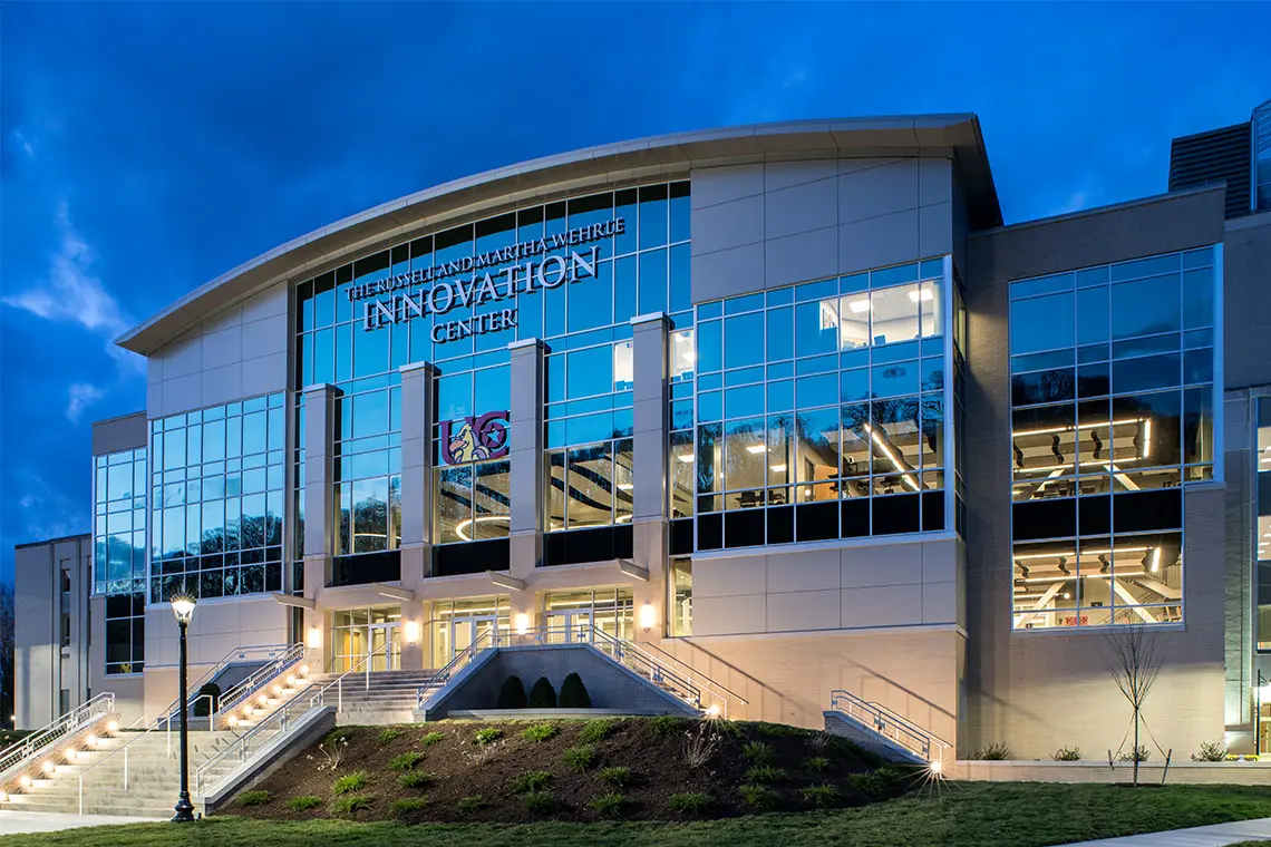 The front facade of the Innovation Center at the University of Charleston at night