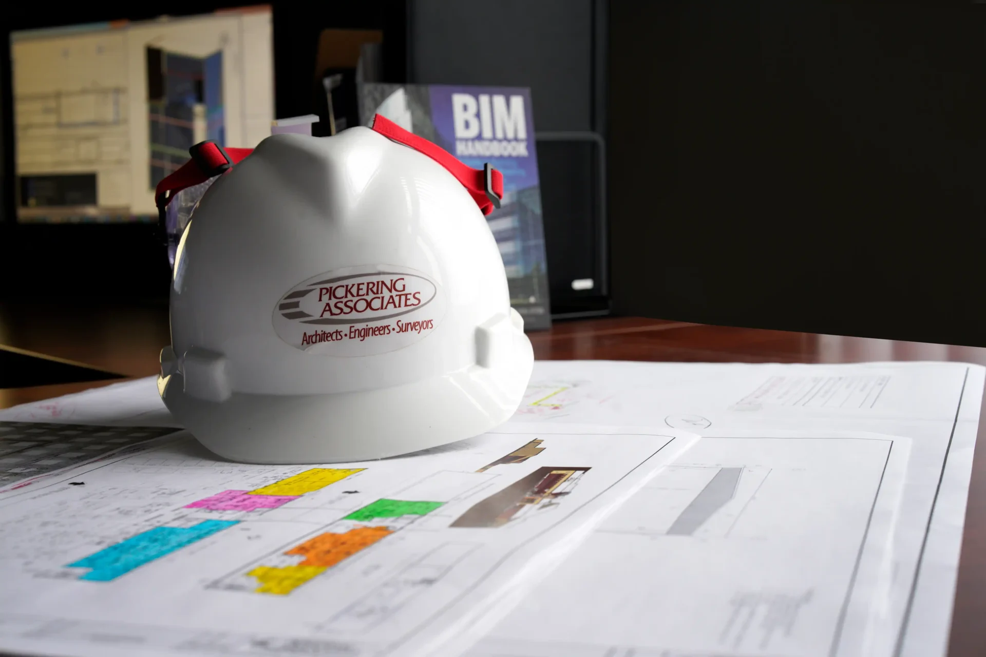 Constuction administration plans and hard hat.