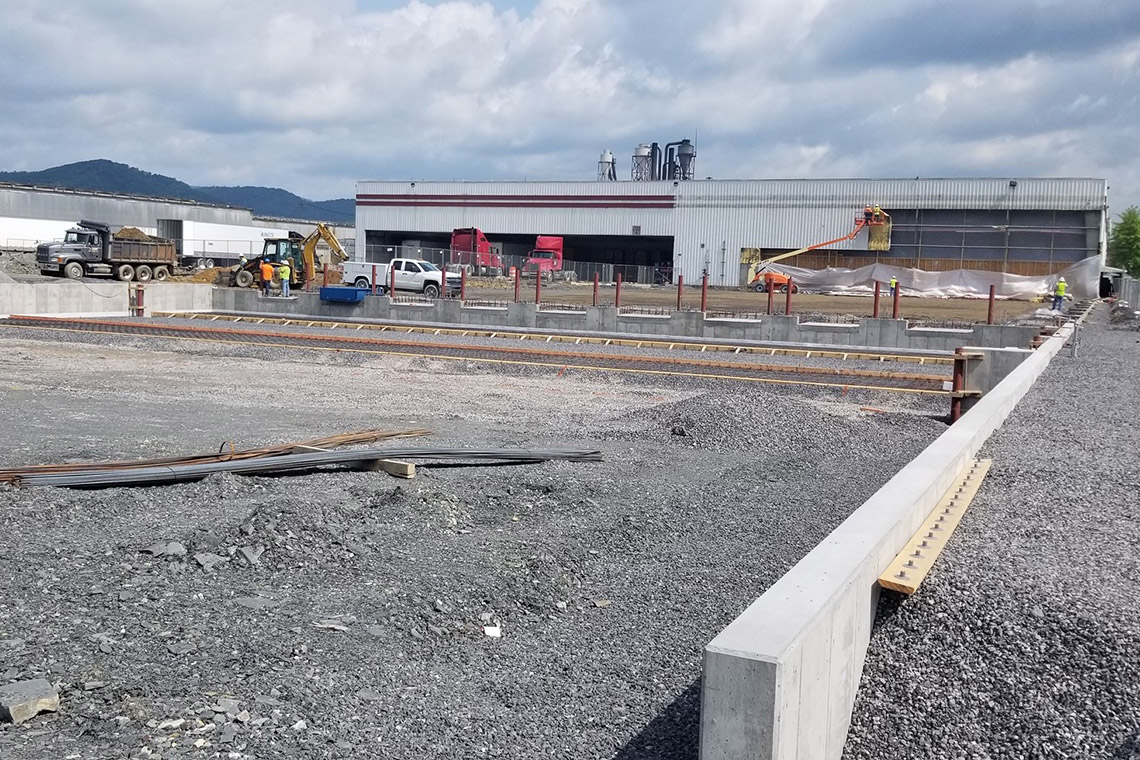 View of the new loading docks under construction with the operational ones visible in the background.