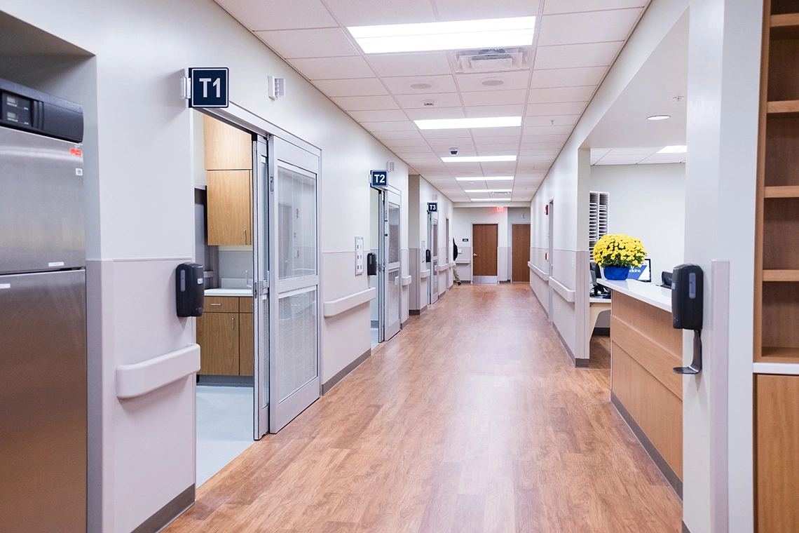 Nurses station and hallway between trauma rooms.