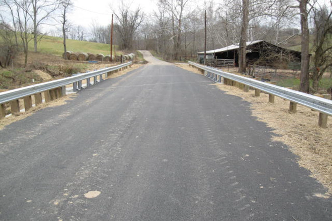 Road realignment and new bridge deck surface.